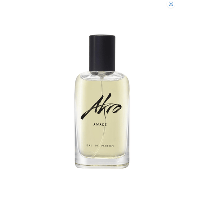 "Bottiglia di profumo Awake di Akro da 100 ml, fragranza unisex energizzante con note di caffè tostato, cardamomo e vetiver, su sfondo moderno e dinamico."
